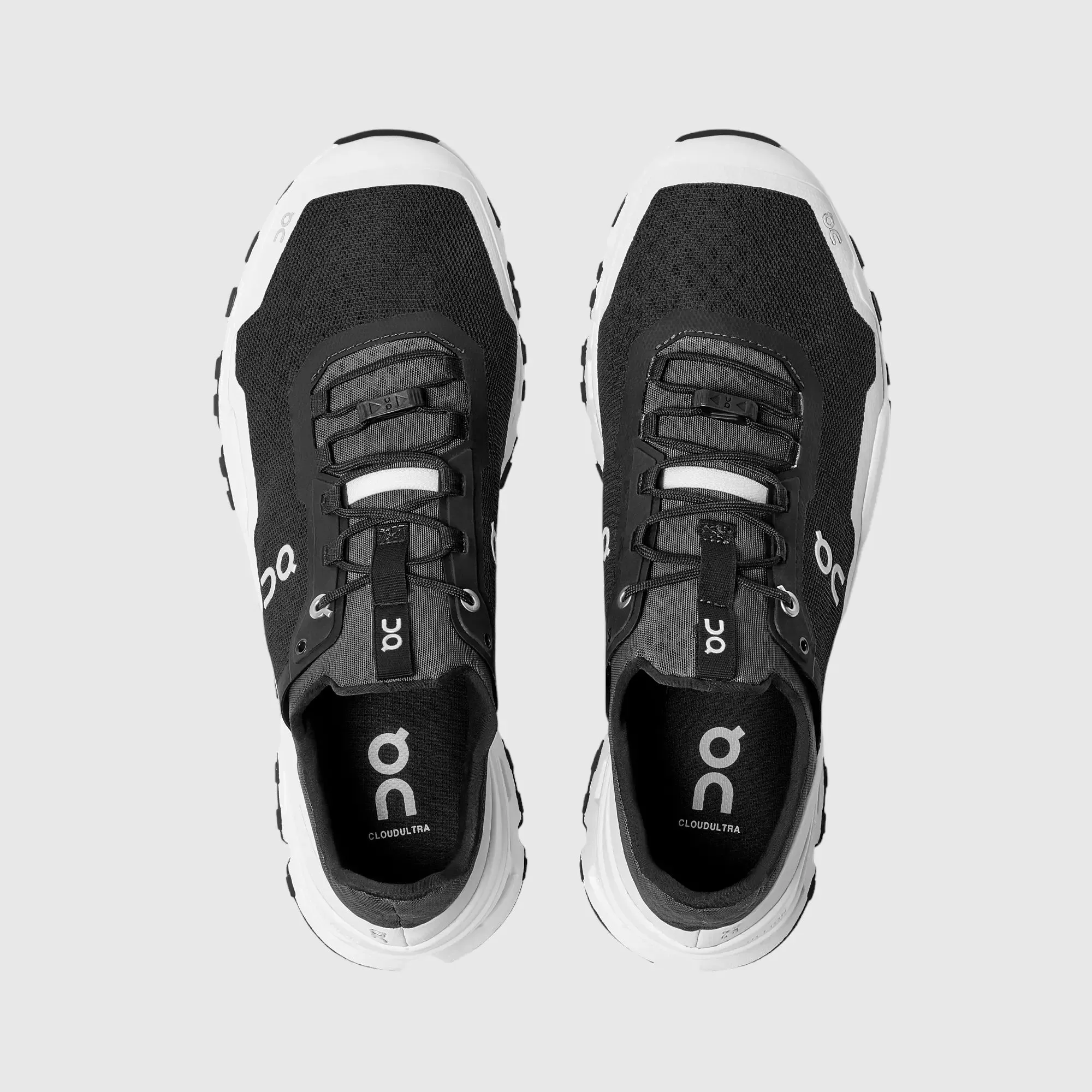 Sure! Here’s an optimized title for the product:

Mens On Cloud Ultra Running Shoes - Black & White Performance Sneakers

This title includes modifiers that highlight the brand, style, and intended use of the shoes.